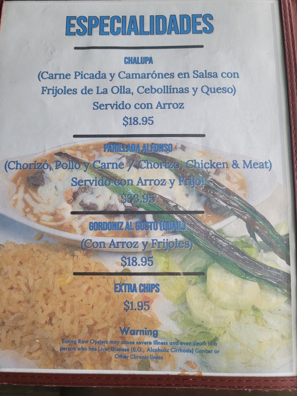 Printed menu with appetizers, stews, and seafood plates.
